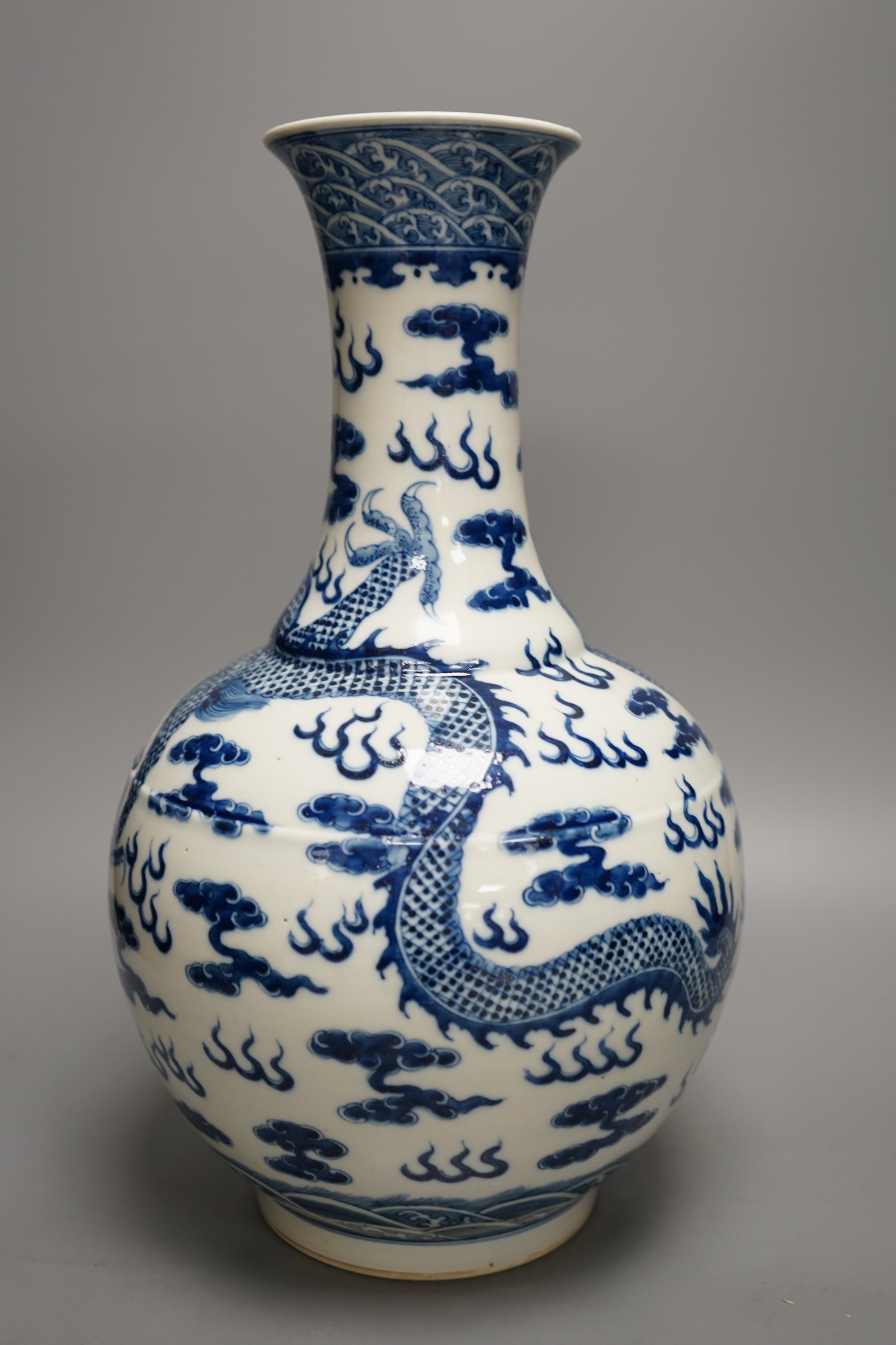 A Chinese blue and white 'dragon' bottle neck vase, 39.5cm tall